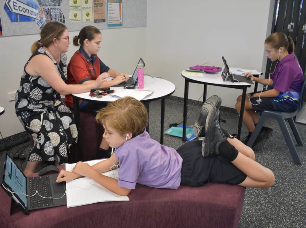 Students and teachers at Mary MacKillop, outstanding school in Cairns, do work inside classroom 